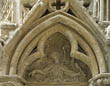 Panel 15:06 - Angel wielding a club and gesturing towards lower-left